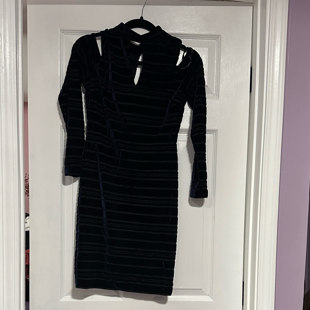 Guess black velvet ruched mini dress with long sleeves and cut-out details.